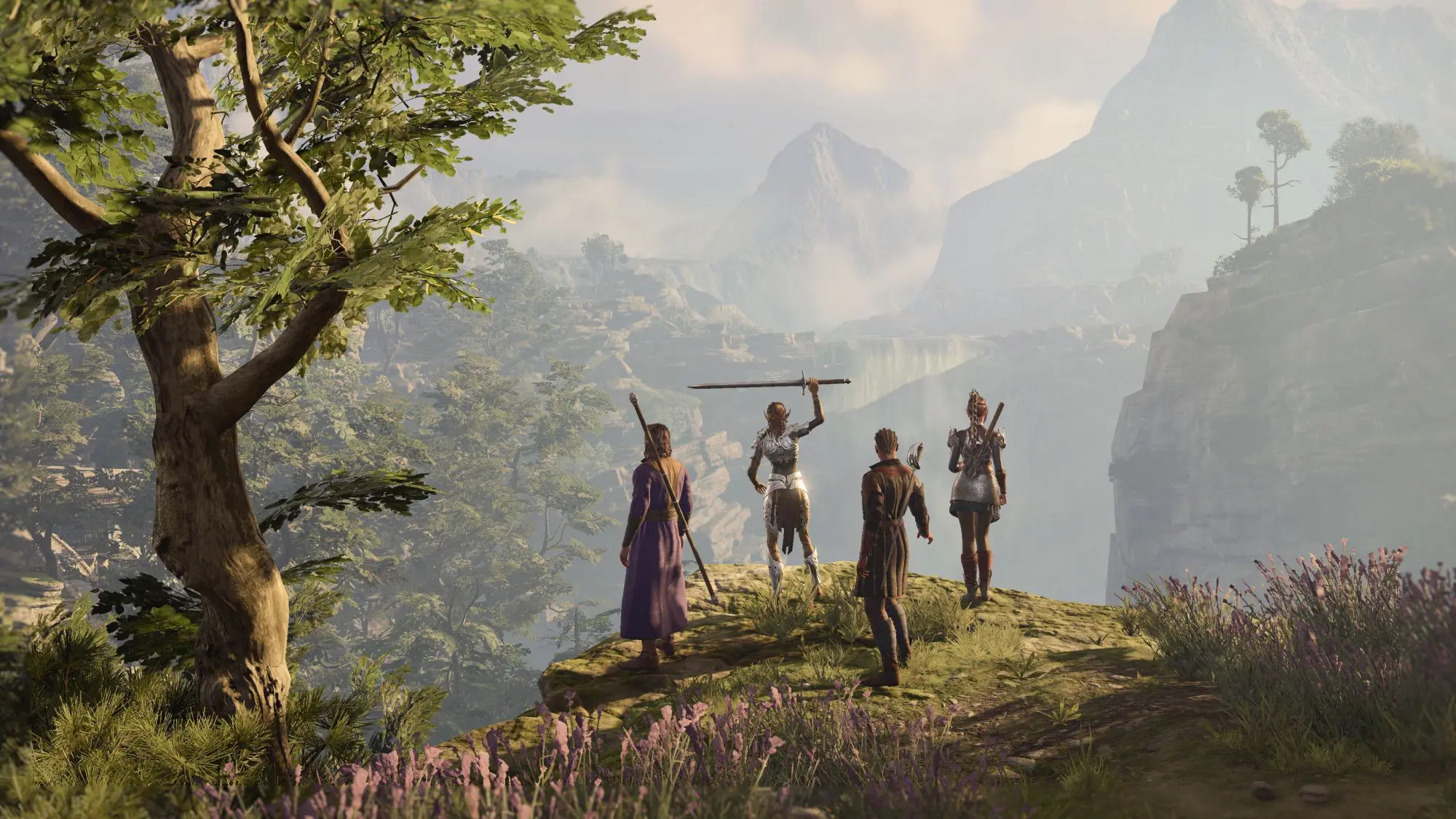 Four figures, two wearing armour and two with weapons slung across their backs, stood on a hill top looking out across a valley.