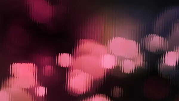 Burgundy lens flares on a fluted navy background